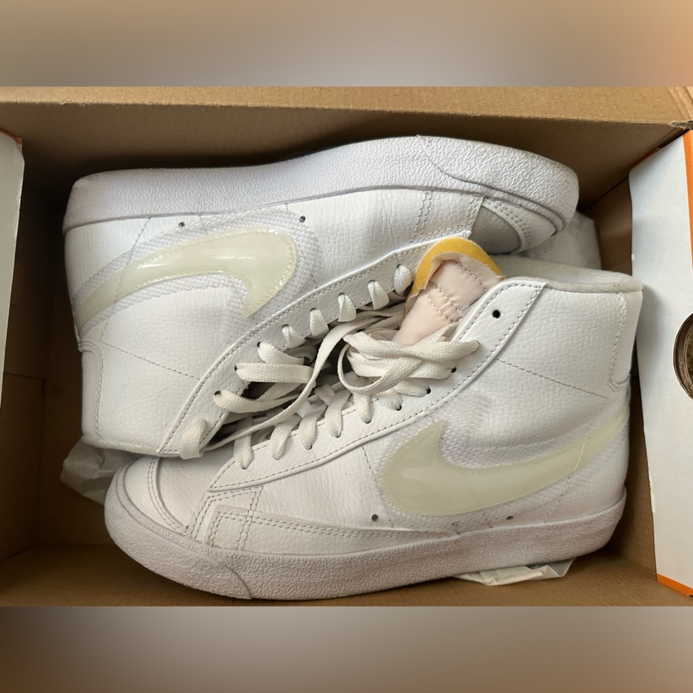 WMNS, all white Nike Blazers.